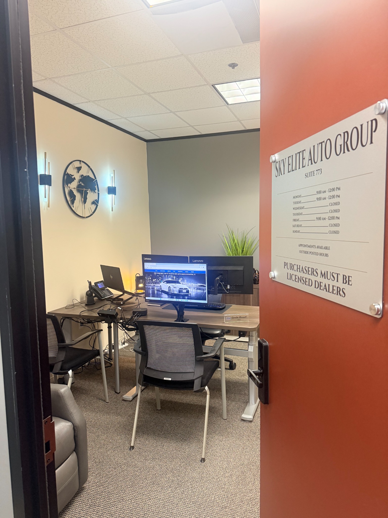 Entrance to the Sky Elite Auto Group Houston office showing dealer-only signage
